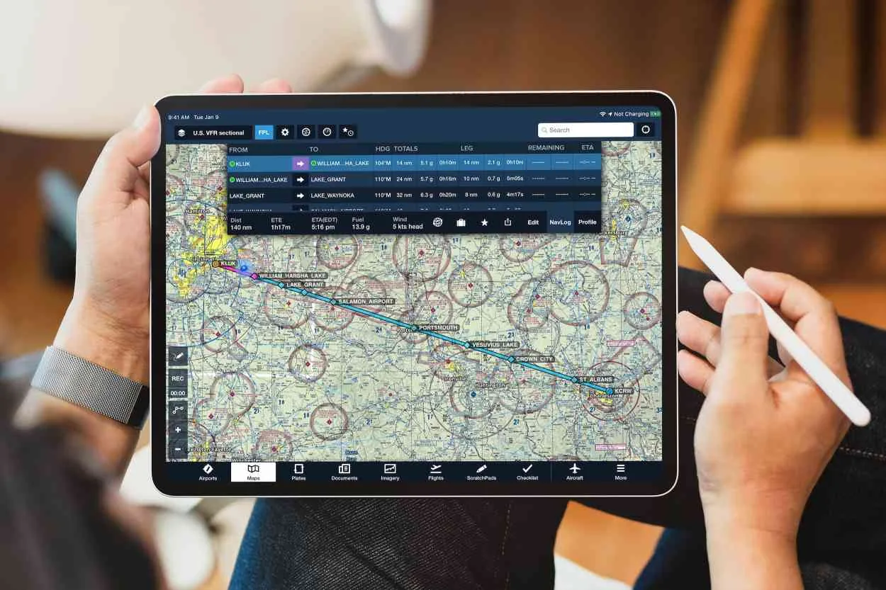 Aviation professional reviewing flight information on a tablet